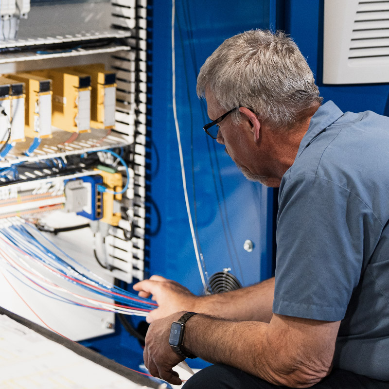 Employee working on machine | Progressive Surface