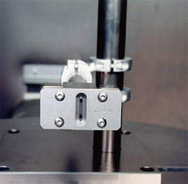 Figure 26 Almen Block with hardened steel mask. Opening simulates the hole diameter | Progressive Surface