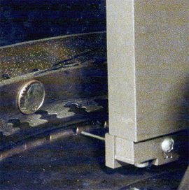 Figure 9 Close-up of deflector pin hole. Dime shown for reference | Progressive Surface